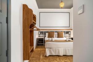 Posteľ alebo postele v izbe v ubytovaní Casa Gracia Apartments