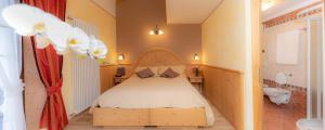 Postel nebo postele na pokoji v ubytování Hotel Capriolo