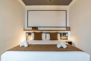 Posteľ alebo postele v izbe v ubytovaní Casa Gracia Apartments