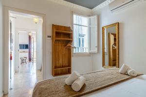 Posteľ alebo postele v izbe v ubytovaní Casa Gracia Apartments
