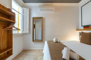 Posteľ alebo postele v izbe v ubytovaní Casa Gracia Apartments
