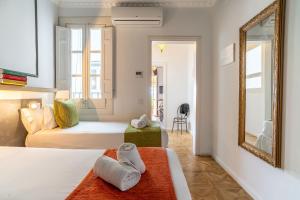 Posteľ alebo postele v izbe v ubytovaní Casa Gracia Apartments
