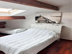 מיטה או מיטות בחדר ב-T3 Duplex Port de Capbreton 800m de la plage