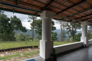 a view from the porch of a house at The Inglewood Bungalow in Yercaud