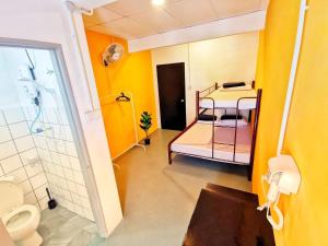 a bathroom with two bunk beds and a shower at The Cocoon Capsule Hotel in Cameron Highlands