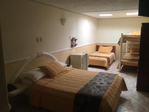 En eller flere senge i et værelse på Hotel San Nicolas