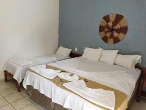Katil atau katil-katil dalam bilik di Pousada Flor de Lotus