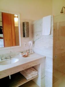 a bathroom with a sink and a mirror at Solar da Ponte in Tiradentes