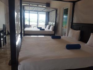 Ліжко або ліжка в номері Sea Port Hiriketiya