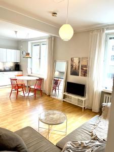 a living room with a couch and a table at Villa Centralen in Helsinki