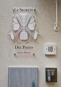 a sign on the side of a guest house at LE SEGRETE DEL POZZO in Capurso