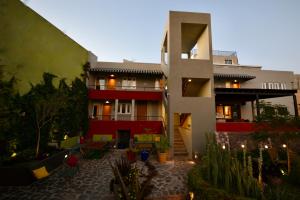 a apartment building with a courtyard with plants and candles at Terra Vista in Guanajuato