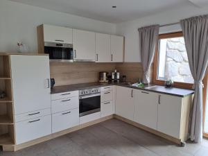 Kuchyň nebo kuchyňský kout v ubytování Ferienwohnung Widmann