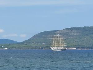 a sail boat in the middle of the water at Arcamyrtus in Alghero
