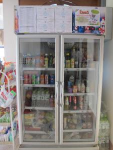 a refrigerator filled with lots of food and drinks at The Star Hotel in Udon Thani