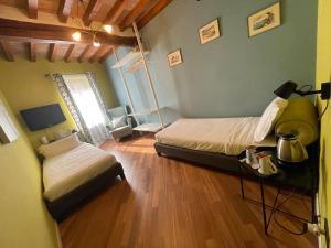 Postel nebo postele na pokoji v ubytování Le Camere di Bsuites Affittacamere
