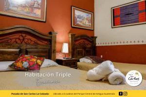 Säng eller sängar i ett rum på Posada de San Carlos La Calzada