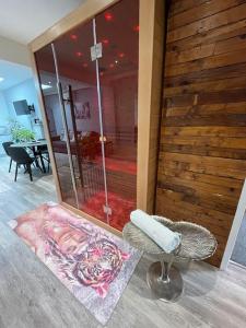 a room with a shower and a stool and a mirror at Terry’s yard, southville, Bristol in Bristol