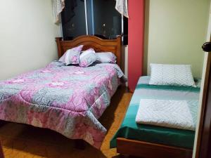 Ένα ή περισσότερα κρεβάτια σε δωμάτιο στο Departamento Puyo Fantastic.