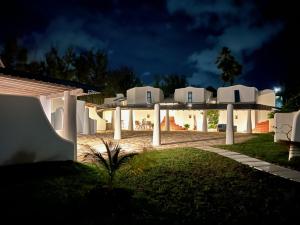 a view of a house at night at OceanBlue Resort in Christ Church