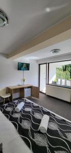 Postel nebo postele na pokoji v ubytování M7 Villa Bed& Bistro