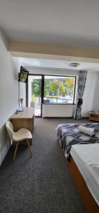 Postel nebo postele na pokoji v ubytování M7 Villa Bed& Bistro
