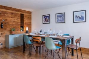 a dining room with a table and chairs at Loft-chalet with exterior and view in Chamonix in Chamonix-Mont-Blanc