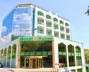 a hotel paloma building with a sign on it at Palma Hotel in Golden Sands