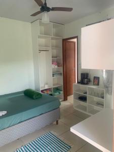 Una cama o camas en una habitación de Hospedagem Entre Marés 18 fotos más