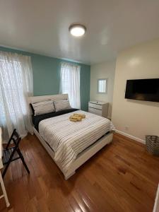 a bedroom with a large bed with white sheets at Beautiful private rooms in a shared apartment upper west side in New York