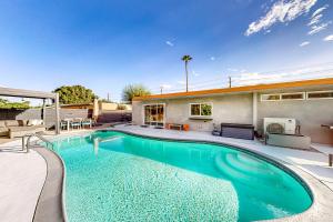 a swimming pool in the backyard of a house at The Sunny Spot Permit# 5084 in Palm Springs