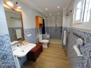 a bathroom with a sink and a toilet at Casa Valparaíso Málaga for everybody in Málaga