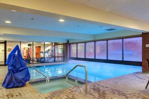 a large swimming pool in a building at The Lodge at Mountain Village in Park City