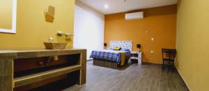 Postel nebo postele na pokoji v ubytování Mi Hotel Club