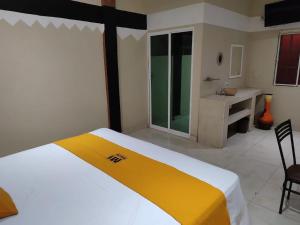Postel nebo postele na pokoji v ubytování Mi Hotel Club
