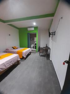 Postel nebo postele na pokoji v ubytování Mi Hotel Club + 12 fotografií