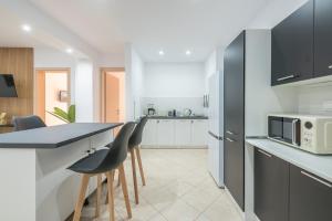 A kitchen or kitchenette at ATHENIAN HOME Near Acropolis