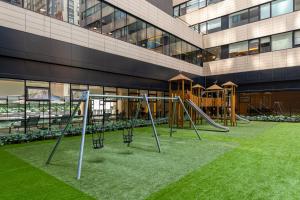 a playground in front of a building at Nido at Neuchatel Polanco in Mexico City