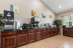 a kitchen with a counter top with a coffee shop at Best Western University Inn in Ithaca