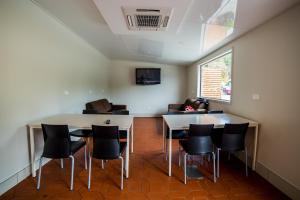 a meeting room with a table and chairs at Te Anau Lakeview Holiday Park & Motels in Te Anau