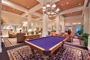 a pool table in a living room with a billiard at Cypress Bend Resort, a Wyndham Hotel in Many