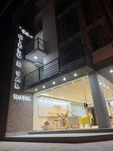 a store front of a hotel at night at Cielo & Sal Hotel in Uyuni