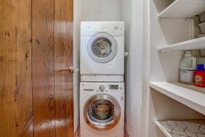 a washing machine and a washer in a kitchen at Earn Your Vacation Stripes in Austin