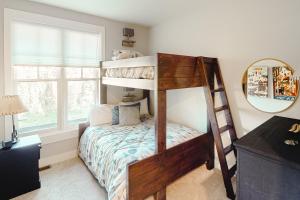 a bedroom with two bunk beds with a mirror at Saddle Ridge B2 in Big Sky