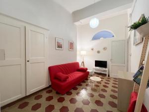 Televízia a/alebo spoločenská miestnosť v ubytovaní Civico 41 Lucca City Center Apartment