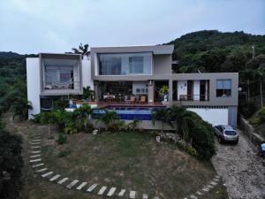 a house with a car parked in front of it at Nuestra Casa in Tubará