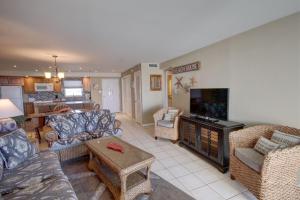 a living room with couches and a flat screen tv at El Matador 165 - Beautiful unit with great view of the Gulf in Fort Walton Beach