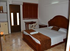 Postel nebo postele na pokoji v ubytování Hotel Tayrona