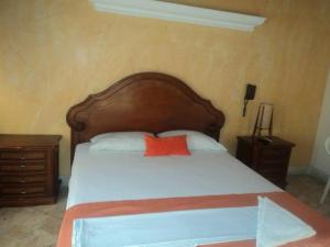 Postel nebo postele na pokoji v ubytování Hotel Tayrona