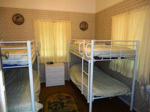 a room with three bunk beds in it at Choongurra in Noosaville
